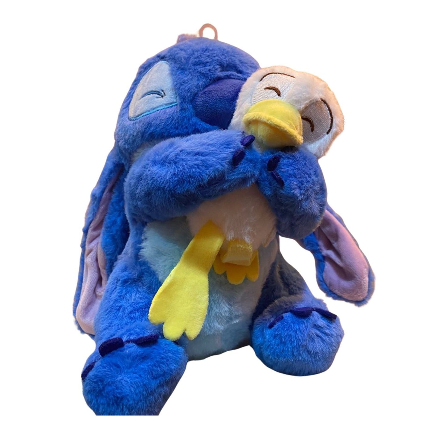 ⭐ Peluche Stitch abrazando patito