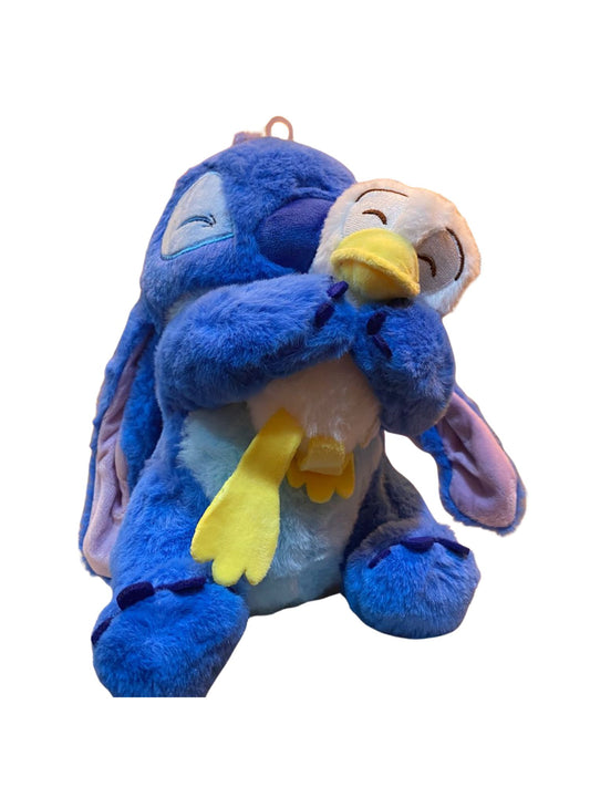 ⭐ Peluche Stitch abrazando patito